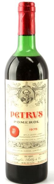 1975 PETRUS POMEROL FULL BOTTLE BORDEAUX WINE: Vintage 1975 Petrus Pomerol with top shoulder ullage. Deep cherry color. Tightly sealed cork. Label complete and clear. Highly rated.