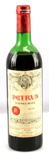 VINTAGE MERLOT PETRUS POMEROL RED WINE 1975: Vintage 1975 Petrus Pomerol Merlot red wine. Label and seal still present. Mid-shoulder ullage. Cherry red color. The label is in very good condition . Tight sealed cork. 730 mL.