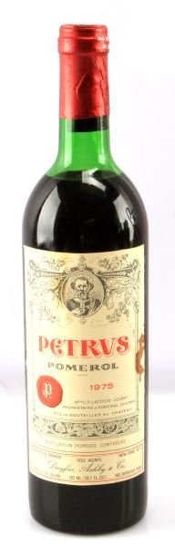 PETRUS POMEROL MERLOT RED WINE VINTAGE 1975: Vintage 1975 Petrus Pomerol Merlot red wine. Label and seal still present. Top shoulder ullage. Cherry red color. The label has some stains but is in very good condition . Tight sealed cork. 730 mL.