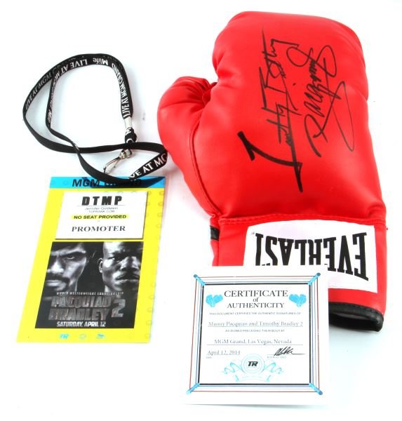 BOXING GLOVE SIGNED BY PACQUIAO AND BRADELY W/ COA: Authentic Everlast boxing glove bearing the signatures of both Manny Pacquiao and Timothy Bradley. Signed after the world welterweight championship that took place on Saturday, April 12, 2014 at the M