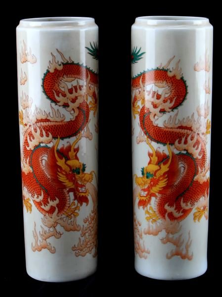 CYLINDRICAL MIRROR IMAGE IMPERIAL DRAGON VASES 11": Vintage cylindrical mirror image vases with 5 clawed Imperial dragon. Transferred image. The bottom has a maker's mark. Measure 11.25 inches tall. Some yellowing, but overall very good condition.