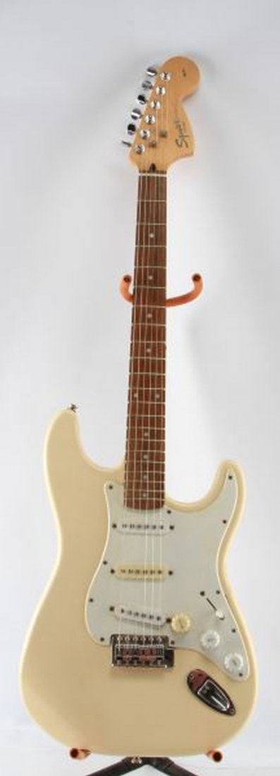 FENDER SQUIER AFFINITY STRAT WITH GIGBAG: An Affinity Stratocaster, originally black but home refinished in Olympic white. In good condition with some overspray on neck, crackling of finish, paint runs and orange peel. Needs adjustment for op