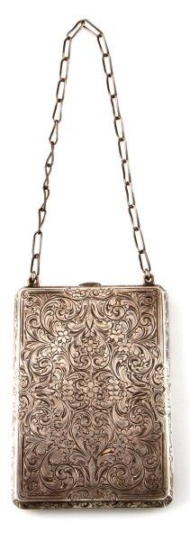 STERLING SILVER ANTIQUE CARD CASE WALLET: Highly detailed foliated and floral engraved Victorian sterling silver wallet. The top edge is engraved with the surname "Byrd". The interior clip is marked with the James E. Blake Co. maker's mark "s