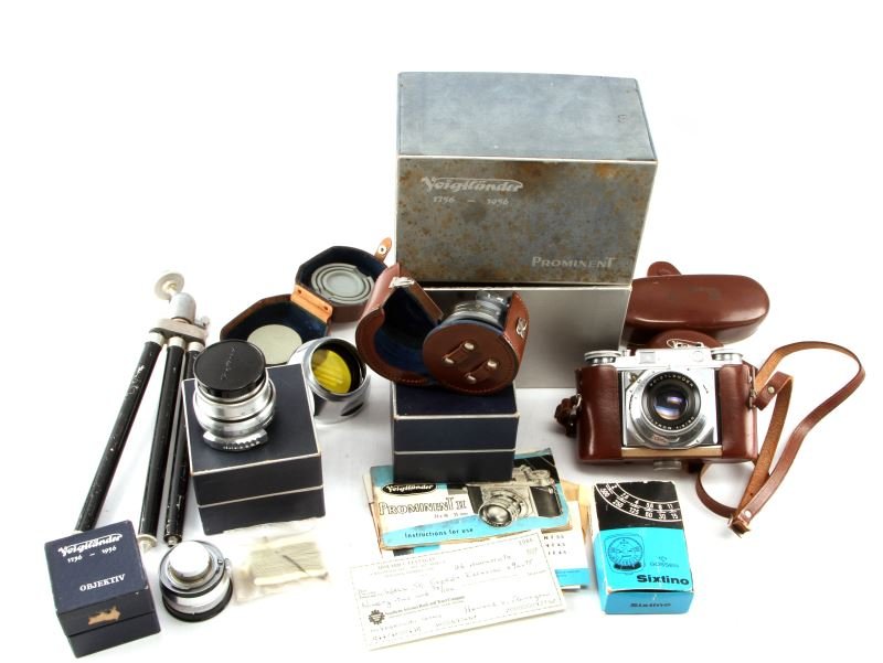 VOIGTLANDER PROMINENT CAMERA W/ 3 LENSES AND MORE: Lot includes one 35mm Voigtlander Prominent camera with original box, booklets, instructions and sale receipt; two Ultron 1:2 50mm lenses; one Dynaron 1:4.5 100 mm lens with box and instructions; one
