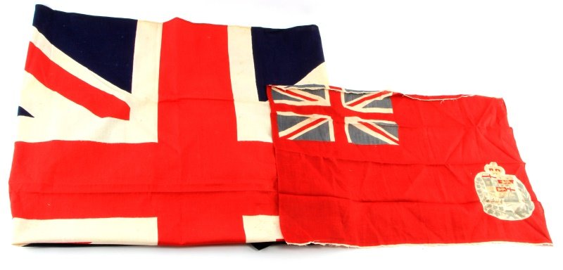 LOT OF 2 FLAGS CANADA AND UK BRITISH SUB INGENTI: Group of two flags. The British flag measures 45 by 32 inches and "British made" marked to flag. The other, a Canadian flag with emblem and "Parva Sub Ingenti" to lower right, measures 23.5 by 15.5 in