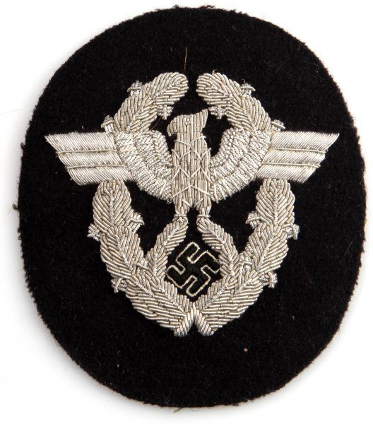 WWII GERMAN POLICE PATCH SILVER BULLION: German WWII Third Reich police patch. No maker mark. Black felt with silver bullion thread. Measures 4 inches tall by 3.5 inches wide. Very good condition. Unauthenticated, sold as is. This lot has a 