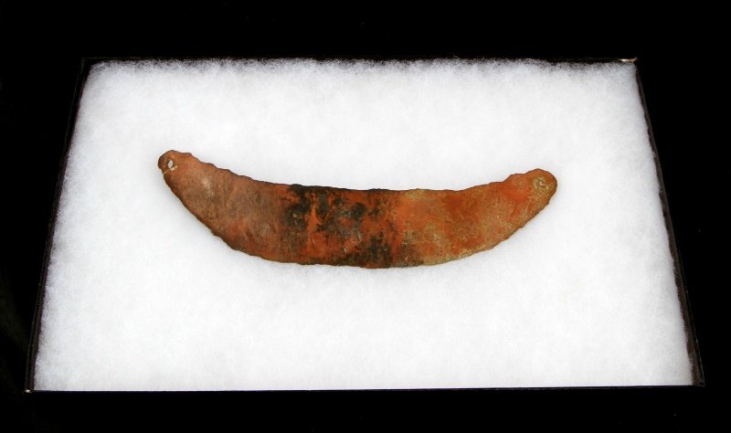 MIDWEST PLAINS HAMMERED COPPER INDIAN GORGET: Two drilled holes, no decoration, excavated condition, from Michigan estate, measures eight inches.
