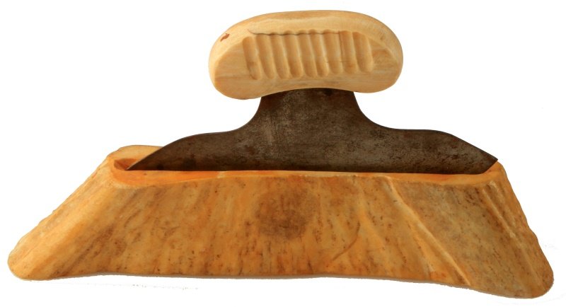 ANTIQUE ALASKAN ULU KNIFE WITH BONE HANDLE & COVER: Antique Alaskan Inuit ulu knife, an all-purpose knife traditionally used by Inuit women. The blade has rusting throughout, a wide bone stand or cover, and a small carved handle. The stand is marked "J