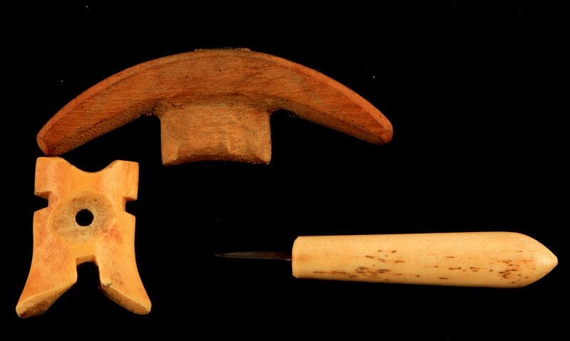 LOT OF THREE ANTIQUE INUIT ALASKAN TOOLS BONE WOOD: Three antique tools from Alaska, includes a wooden tool and two bone tools. Very good condition. The bone awl measures 3 inches long.