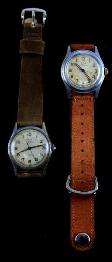 TWO MENS VINTAGE NICKEL PLATED WATCHES: Both mid-size (30.5mm in diameter), both nickel plate over base metal, one made by Felea, pin lever movement. Second by Eros, 17 jewel movement. Both stem wind and set, both have leather straps. Both