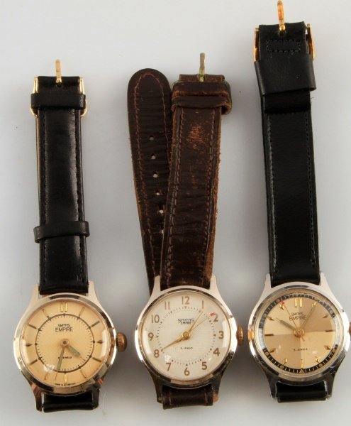 SMALL LOT OF 3 MENS VTG SMITHS EMPIRE WRISTWATCHES: Men's watches, jeweled movements, stem wind and set, by Smiths of England, Empire series. All 33mm cases, two gold plate, one nickel plate. All have leather straps. All running.