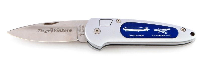 BOKER TREE BRAND "THE AVIATORS" FOLDING KNIFE: One Boker folding knife. Item features a gray and blue handle with images of the 1900 Zeppelin, 1927 C. Lindbergh, 1971 Concorde, and 1981 Space Shuttle. Item features a stainless steel blade, engrave