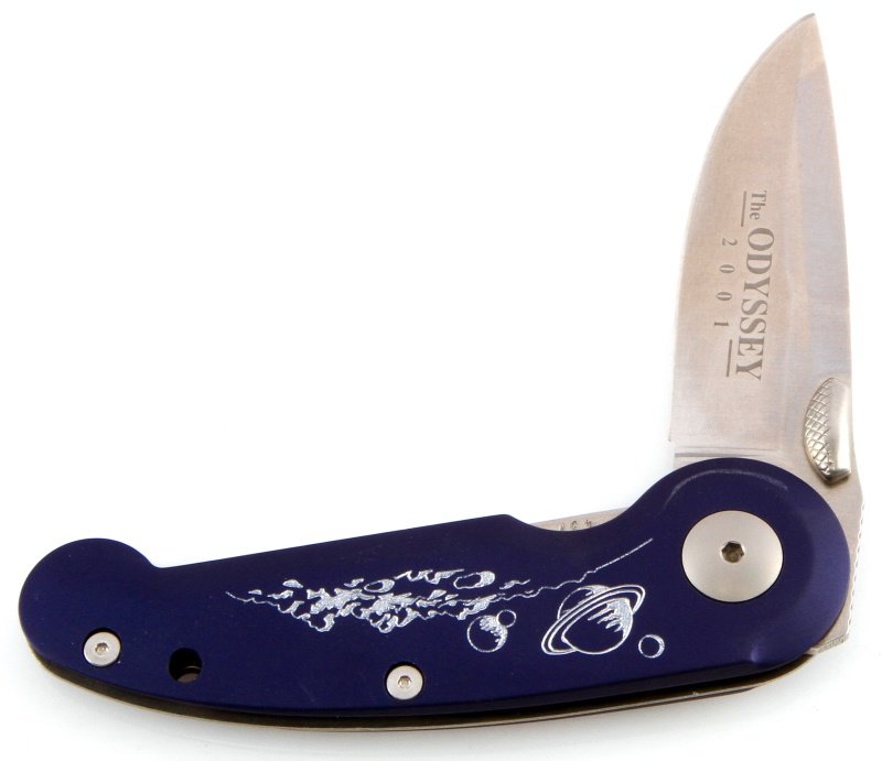 BOKER TREE BRAND ODYSSEY 2001 FOLDING KNIFE: One Boker Odyssey 2001 folding knife. Item features a deep blue anodized aluminum handle with etched silver space landscape, and a titanium thumb stud, and a 440C stainless steel blade. Item weighs 3