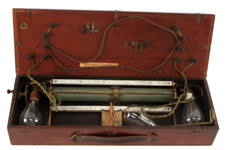 EARLY 20TH CENTURY PHOTOMETER IN WOODEN HOUSING: Late nineteenth to early twentieth century photometer in wooden housing. Comes with three old bulbs. Has leather carry handle. Box measures approximately 21.5 inches in length. Functionality unknown. 
