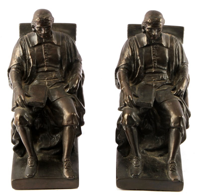 ANTIQUE MARION BRONZE JOHN HARVARD BOOKENDS: Pair of antique bookends by Marion Bronze. The bronze-clad bookends depict John Harvard. The figures are in overall good condition, with no apparent detractions. Measures 8.5 inches tall by 6.5 inches