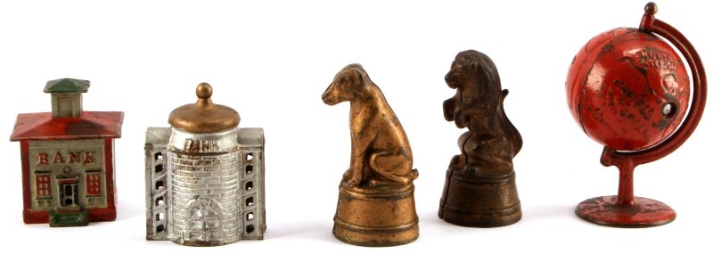 5 ANTIQUE BUILDING & STATUE & GLOBE CAST IRON BANK: This lot contains five vintage coin banks, featuring two statues of a dog & lion, two buildings and a red globe. All five items are in original condition, including paint, and show no signs of visible