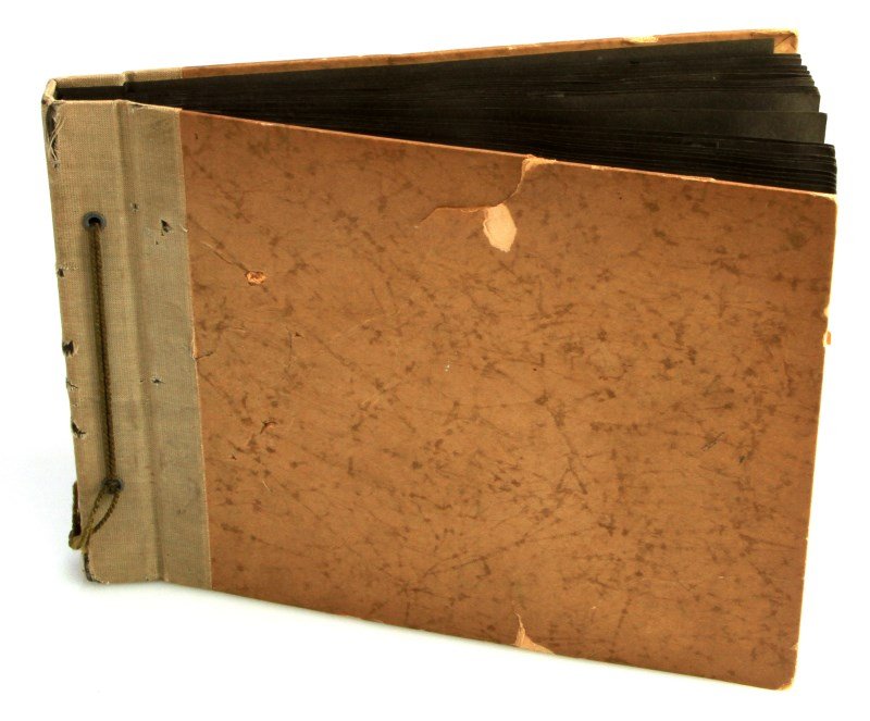 WWII GERMAN LUFTWAFFE PILOT PHOTO ALBUM: Photo album created by Willi Sander, a member of the Luftwaffe. The album includes seventy four original photographs with additional postcards and flight records. Includes photographs of: airplanes, c