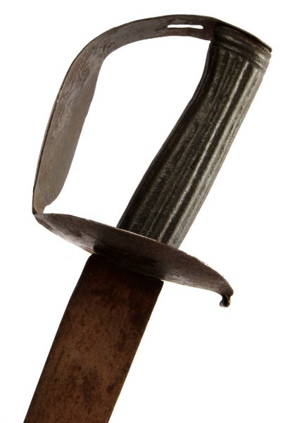 MID-NINETEENTH CENTURY NAVAL CUTLASS: Mid-nineteenth century naval cutlass. Iron hilt and grip. Some rust but sword in solid condition. Blade measures approximately 27.75 inches.