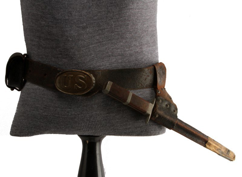 CIVIL WAR FIGHTING KNIFE & BELT RIG US BELT PLATE: Hand crafted zinc and wood handled 12 inch overall knife, unmarked blade, is in a cut down bayonet scabbard with a belt and correct "Puppy Paw" U.S. belt plate also has cartridge case, leather is mode