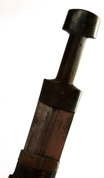 19TH CENTURY COSSACK ISLAMIC SHORT SWORD: Double edged with center blood grove, deeply cut sword smith's mark on both sides. Horn grip, scabbard is leather over wood with decorated silvered iron chape. overall length in scabbard is 20 inches.