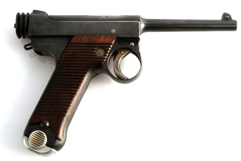 WWII JAPAN NAMBU T14 8MM SEMI AUTO PISTOL W SHELL: WWII Japanese Nambu Type 14 8mm pistol. Nagoya Kokubunji 1st run markings to right side. Showa date 11.3. Steel retains 85% finish, serrated wood grips are great, and matching magazine. Bore is bright