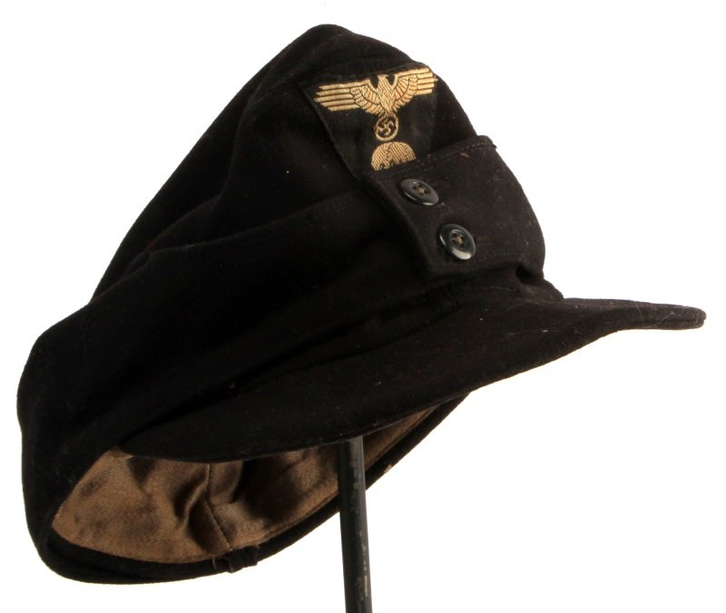 SS M43 THIRD REICH WWII GERMAN FIELD CAP: WWII German SS M43 field cap in black wool. The cap has a triangle totenkopf insignia with SS eagle on the front. No holes or mothing. Very good condition. Marked 58 on the interior. Passes blacklight