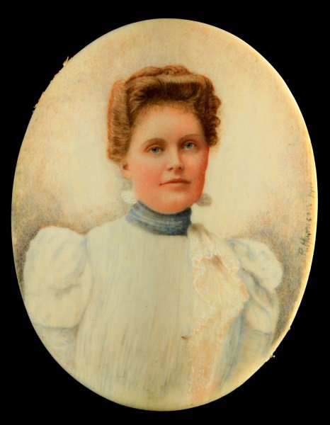 SMALL SIGNED AND DATED PORTRAIT OF A LADY ON IVORY: A portrait of a lady on ivory signed "R. Harrison 1911". Measures 3 4/16 inches in height by 2 7/16 inches in width.