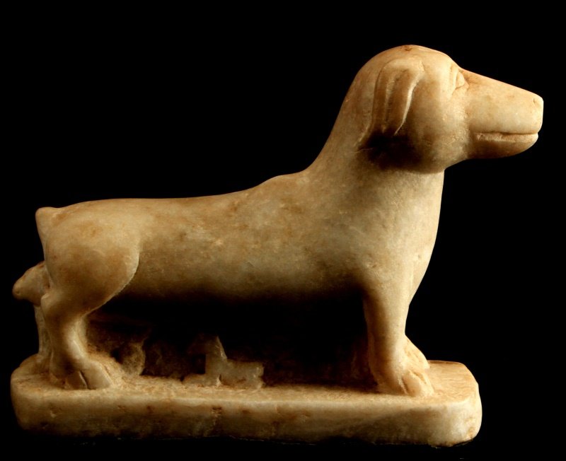 VINTAGE CARVED MARBLE DOG STATUE: Interesting carved marble piece. Long dog, maybe Daschund. Horse carved below body of dog, another dog sitting between hind legs. Green felt to bottom. Measures 9.5 inches long and 7 inches tall. Weig