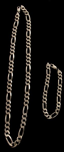 MENS/LADIES STERLING FIGARO NECKCHAIN/BRACELET SET: For men or ladies, sterling silver flat Figaro style with alternate link engraving. Bracelet measures 9 1/4 inches, 8mm wide. Neck chain is just over 24 inches long, 9mm wide, same pattern. Total ster