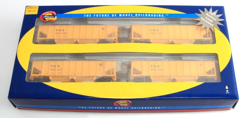NIB ATHEARN 40' OUTSIDE BRACED BALLAST HOPPER 4 PC: 4 pack of unopened HO Scale 40' Ready to Roll Athearn PRR Outside Braced Ballast Hoppers. All four hoppers are yellow with grey/silver ballast loads, all four of which are included. Item is unopened a