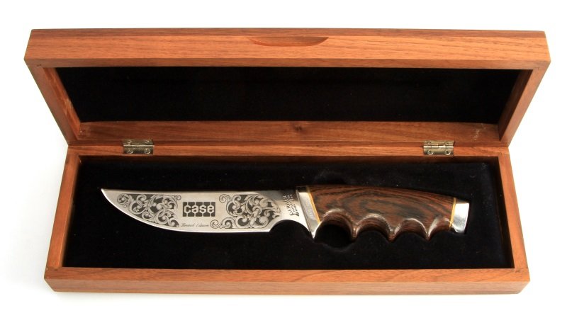 RARE LTD GERBER CASE SILVER 25TH ANNIVERSARY KNIFE: Limited Edition Gerber Case Knife, model 525, celebrating the 25th anniversary of Case Loader/Backhoe. This handcrafted knife features a wooden grip and decorated steel blade reading "Commemorating 25