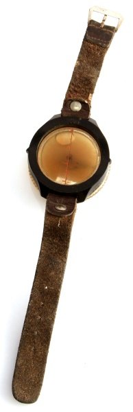 WWII BAKELITE SBE STAMPED CZECH WRIST COMPASS: Fluid filled with leather strap, overall very good condition, although fluid is dark.