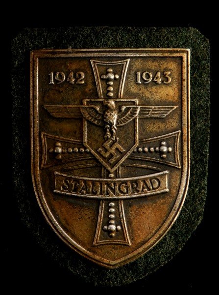 GERMAN WWII THIRD REICH STALINGRAD SHIELD: Some wear and discoloring present to shield. Overall in very good condition. Unauthenticated as is.