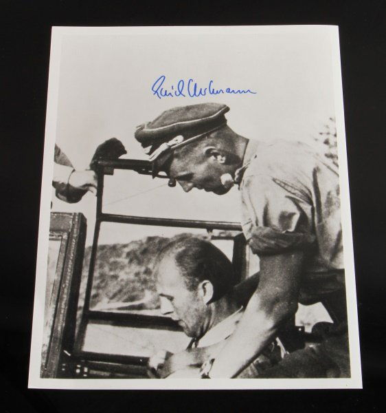 SIGNED 8 BY 10" PHOTOGRAPH OF ACE ERICH HARTMANN: Signed photograph of WWII German Luftwaffe ace Erich Hartmann. Measures 8” wide by 10” tall. Signed in blue ink.