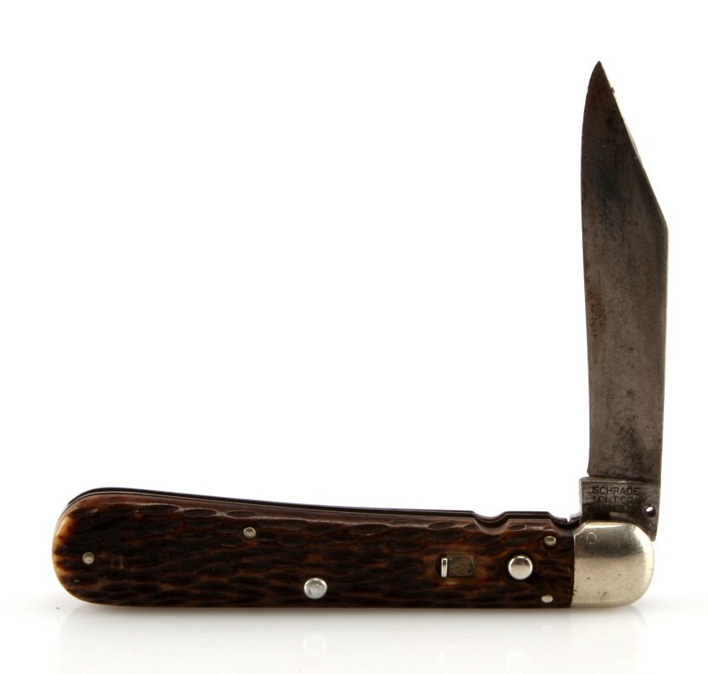 US WWII ARMY AIRBORNE PARATROOP SWITCH BLADE KNIFE: Measures 8 5/8" long overall with steel blade open. It is marked "Schrade Cut Co Walden NY US pats Dec 21, 09; Sept10, 10; June 6, 16". Has a pair of stag antler handles. A scarce combat side arm.