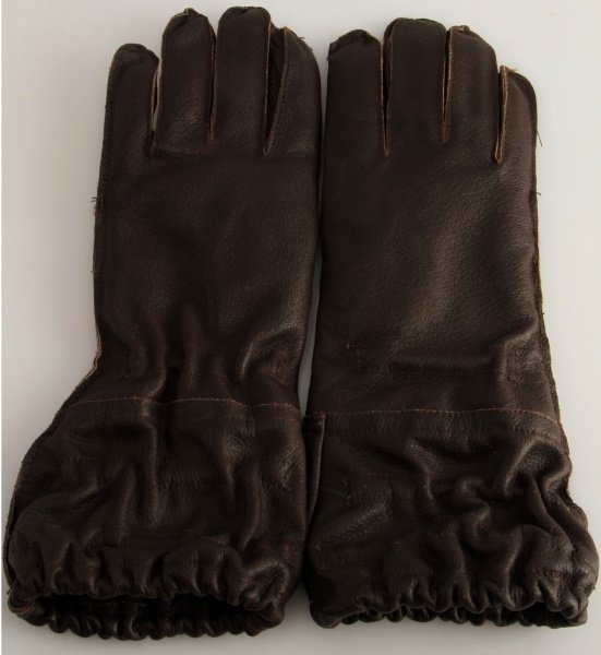WWII THIRD REICH GERMAN PARATROOPER GLOVES: Pair of German World War II Luftwaffe Paratrooper Fallschimrjager Jump Gloves. They measure 4 1/2" wide by 13 3/8” long. The inside is maker marked ‘RB Nr 080/4642/6704’. Each glove has two spri