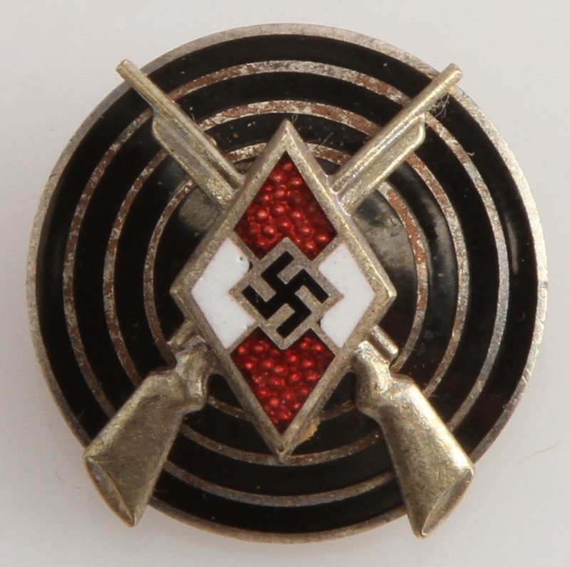WWII THIRD REICH HITLER YOUTH MARKSMAN BADGE: German World War II Silver Hitler Youth HJ Marksman Badge. Measures 13/16” in diameter. The front shows the Hitler Youth diamond in the center with a pair of crossed rifles behind. Both are mounted 