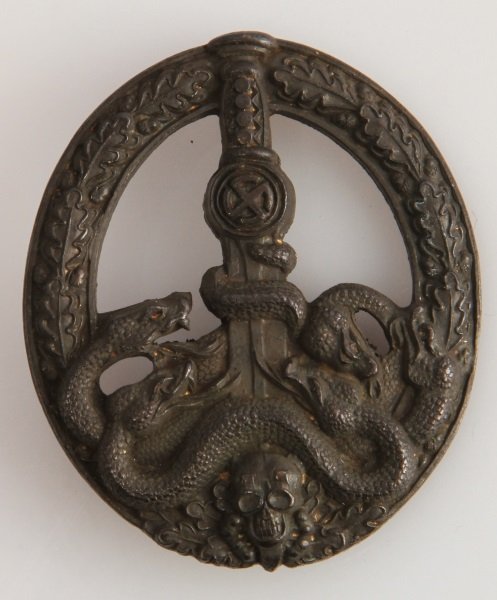 WWII GERMAN ANTI PARTISAN BADGE THIRD REICH: German World War II Army Bronze Anti Partisan Badge. Has a "coke bottle" pin with "c" catch. The reverse is hollowed out the snake heads are cut out. No apparent maker's mark. Very good condition. Una
