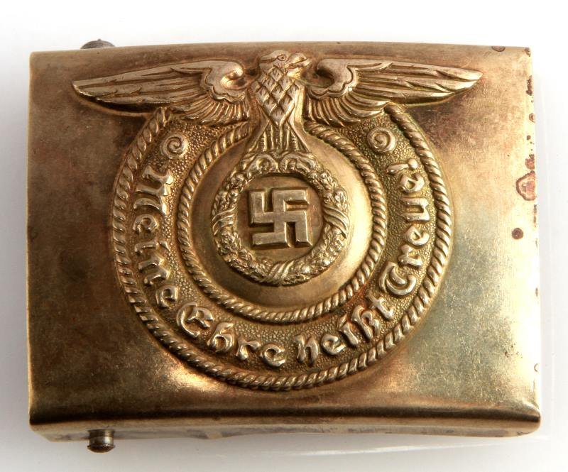 WWII THIRD REICH GERMAN WAFFEN SS EM BELT BUCKLE: German World War II Waffen SS Enlisted Mans Belt Buckle. The reverse side is maker marked ‘O & C ges gesch’. Stamped construction. In very good condition. Unauthenticated, sold as is.