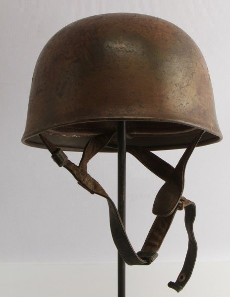 WWII THIRD REICH LUFTWAFFE PARATROOPER M38 HELMET: German World War II Luftwaffe Paratrooper Fallschimjager Camouflage Helmet. The exterior is painted green. The four bolts are the slotted with a vent hole type. The inside skirt is stamped ‘ET 68 22