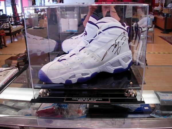 SHAQUILLE O'NEAL AUTOGRAPHED SHOE: Size 22 Reebok O'neal shoe in plexiglass display with name plaque at base. Autographed #34. 16" x 13" x 11".