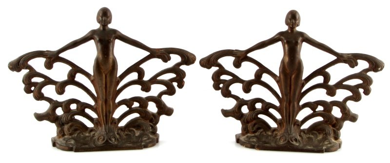PAIR OF CAST IRON ART DECO BOOKENDS/ SCONCES 8.25": Pair of antique cast iron Art Deco bookends or sconces. No apparent maker's marks. The reverse has flathead screws for mounting. Very good condition. Measures 8.25 inches tall by 10.5 inches wide.