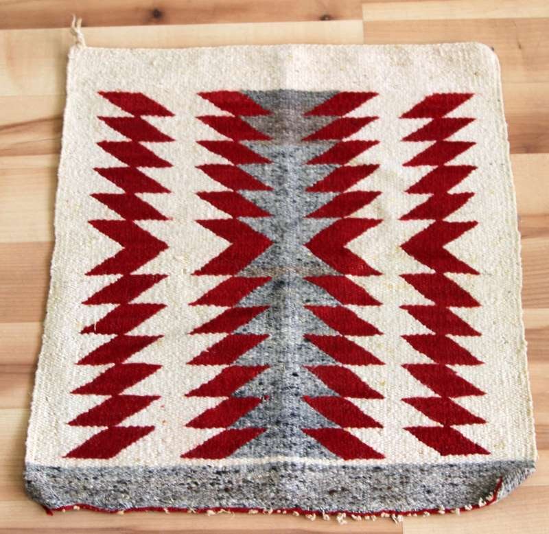 EARLY 20TH CENTURY AUTHENTIC HOPI SADDLE BLANKET: 22" X 19". Vintage 20th Century Hopi Indian Saddle Blanket Rug. This Blanket exhibits a serrated diamond zig zag design with mainly red and grey colors. The blanket is in very good antique condition w