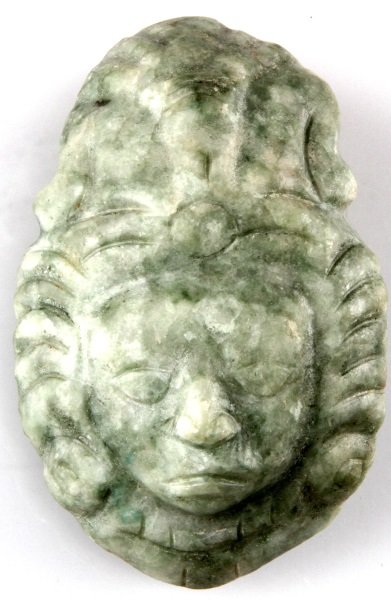 BELIZE MAYA PRE COLUMBIAN GREEN JADE MASKETTE: A Mayan jade maskette measuring 2.75 by 1.75 by 1 inches. Acquired by a Louisiana Merchant Marine in 1950 or earlier. New river, Belize isolated find. All items are legal to buy under U.S. Statute cov