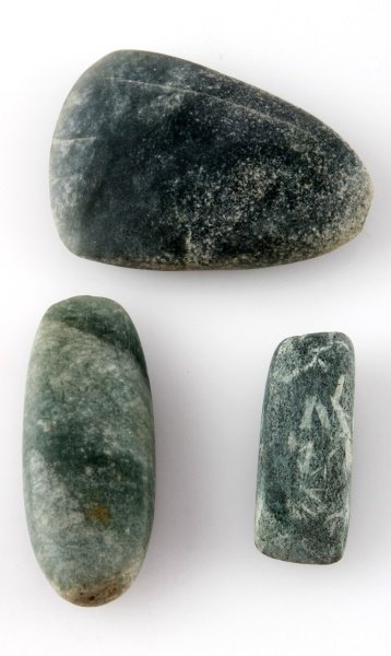 LOT OF THREE GREEN STONE MAYA ARTIFACT CELTS: Pre-Columbian green stone small celt lot of three. The longest tool measures 3 inches long and the widest tool measures 1.75 inches wide. Acquired by a Louisiana Merchant Marine in 1950 or earlier. Ne