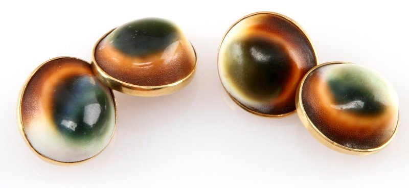 14 KARAT YELLOW GOLD OPERCULUM CUFFLINKS: A pair of 14k yellow gold cufflinks featuring green, brown and white operculum. Weigh approximately 7.5 grams each. Measure an average of 18mm at the widest point of the cup member. In very good condi