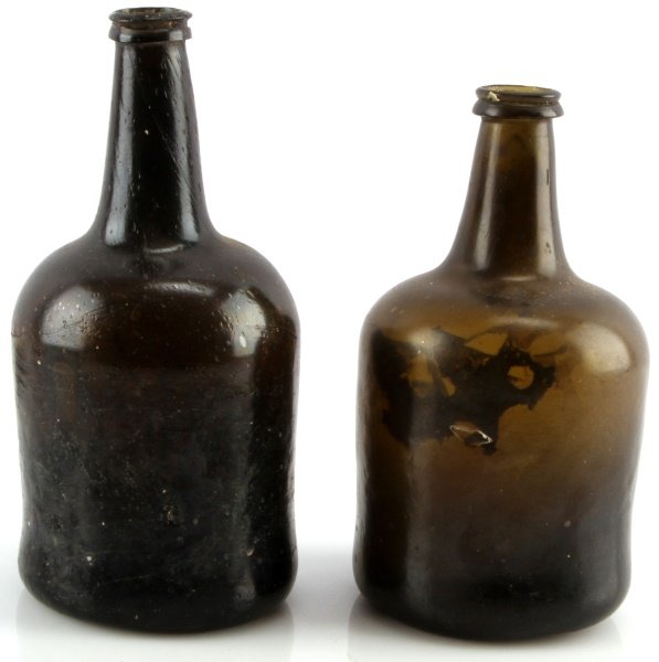 TWO ANTIQUE BLACK GLASS ENGLISH MALLET BOTTLE LOT: Very good complete condition, ground pontil, one is nine inches one is 8.