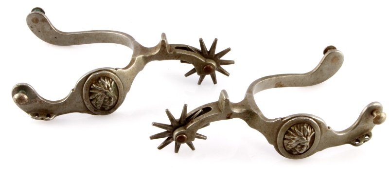 ANTIQUE AUGUST BUERMANN INDIAN HEAD SPURS: Very desirable spur maker, Star Steel Silver followed by star, measuring 6 6/8 inches, 3 inch wide. Indian in headdress on button.