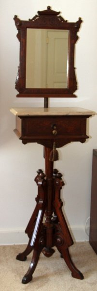 EASTLAKE MARBLE TOP TALL WASH SHAVING STAND: Eastlake Marble top Shaving stand with adjustable mirror. Dovetail drawer with lock and key. Mahogany veneer. Measures 17 inches long, 19 inches wide, 43 inches tall without mirror, and 63 inches tall