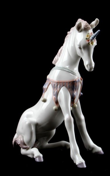 LLADRO PLAYFUL UNICORN FANTASY PORCELAIN 8.5": Retired Lladro figurine titled "Playful Unicorn" designed by Jose Luis Alvarez . Measures 8.5 inches tall. Very good condition; no cracks, or crazing. However three small petals are damaged. Made in S